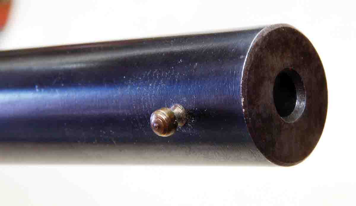 The muzzle of a Stevens smoothbore uses a normal barrel diameter and a brass bead shotgun sight.